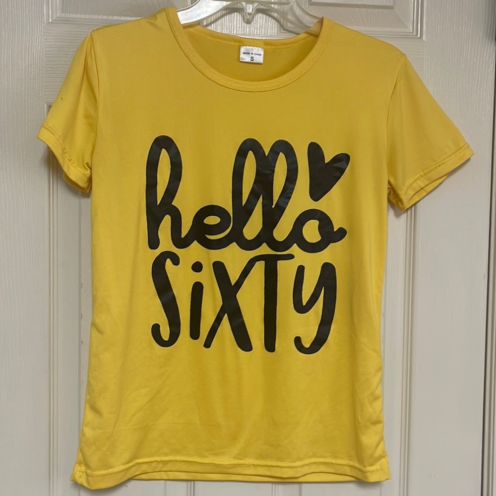 “hello sixty” size small yellow shirt.